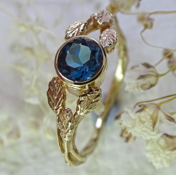 Entwining Leaves, London Blue Topaz, 5mm. 9ct gold